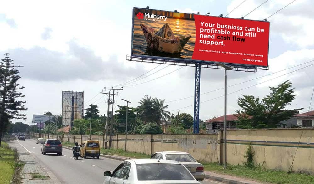 Mulberry Partners billboard about cash flow support, raised above a Lagos road.
