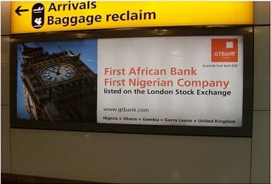 GTBank “First African Bank, First Nigerian Company listed on the London Stock Exchange” lightbox under the Heathrow baggage reclaim gantry.