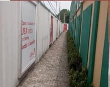 Bank branding running the length of the perimeter wall walkway at the Lagos Tennis Club.