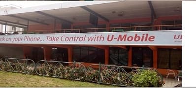 “Bank on your Phone… Take Control with U-Mobile” fascia running the width of a branded building frontage.